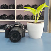 b) Nikon D90 DSLR Camera with 18-105mm VR Lens | 12.3MP | HD Video | Reliable Nikon DX Camera | SK252