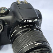 b) Canon EOS 1500D DSLR Camera with 18-55mm IS II Lens | 24.1MP | Full HD Video | WiFi | AB04