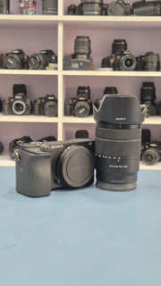 c) Sony Alpha A6400 + 18-135mm Zoom Lens (Excellent Condition)