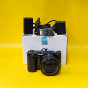 a) Sony ZV-E10 Mirrorless Camera with 16-50mm f/3.5-5.6 OSS Lens | 24.2MP APS-C | 4K Vlogging Camera