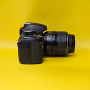 b) Nikon D3100 DSLR Camera with 18-55mm G VR Lens | 14.2MP | Full HD Video | Beginner Friendly DSLR | Budget Photography Camera | Code AB06 📸