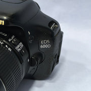 a) Canon EOS 600D DSLR Camera with 18-55mm Lens | 18MP | Vari-Angle Display | Perfect for Beginners & Creators SK1038