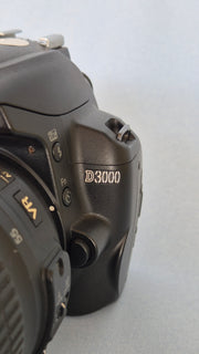 c) Nikon D3000 with 18-55mm Lens – 10.2MP DSLR Camera | Beginner Friendly | Sharp Image Quality