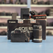 a) Canon EOS R10 Mirrorless Camera with RF-S 18-150mm IS STM Lens | 24.2MP APS-C | 4K Video | Fast Hybrid Autofocus | Compact All-Rounder | SK1046