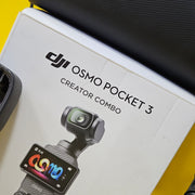 a) DJI Osmo Pocket 3 Creator Combo | 1-inch CMOS Sensor | 4K/120fps | 3-Axis Gimbal | Vlogging Camera Kit