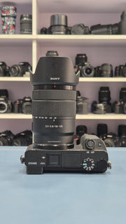 c) Sony Alpha A6400 + 18-135mm Zoom Lens (Excellent Condition)