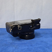 c) Sony Alpha A6000 + 16-50mm OSS Lens – Perfect for Photography & Video