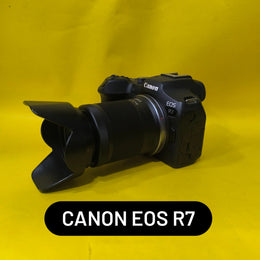a) Canon EOS R7 with RF-S 18-150mm F3.5-6.3 IS STM Lens | 32.5MP APS-C Mirrorless Camera for Wildlife, Sports & Hybrid Creators | SK148