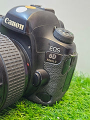 a) Canon EOS 6D Mark II DSLR Camera with 24-105mm Lens | 26.2MP Full-Frame Sensor | Dual Pixel Autofocus | Full HD Video | Versatile L-Series Zoom Kit | SK1055