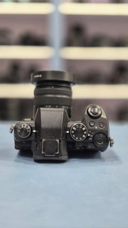 c) Panasonic Lumix G85 with 14-42mm Lens – 16MP 4K Mirrorless Camera | Weather-Sealed | 5-Axis Stabilization
