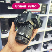 b) Canon EOS 700D DSLR Camera with 18-55mm IS II Lens | Full HD Video | Touchscreen Display | SK1009