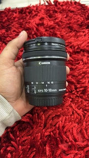 b) Canon EF-S 10-18mm f/4.5-5.6 IS STM lens SK1005