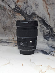 a) Sigma 50mm f/1.4 DG HSM Art Lens (Canon EF Mount) | Ultra-Sharp Prime | Beautiful Bokeh | Low-Light Performer | SK1050