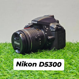 a) Nikon D5300 DSLR Camera with 18-55mm f/3.5-5.6 VR Lens | 24.2MP APS-C Sensor | Full HD Video | WiFi & GPS | Vari-Angle Screen | Beginner Friendly Photography Camera 📸🔥