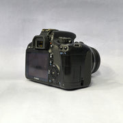 a) Canon EOS Rebel T2i DSLR Camera with 18-55mm Lens | 18MP | Full HD Video | Perfect for Beginners & Creators SK1039