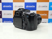 a) Canon EOS 70D DSLR Camera with 18-135mm IS Lens | 20.2MP APS-C Sensor | Dual Pixel Autofocus | Full HD Video | Versatile Zoom Kit | SK1053