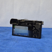 c) Sony Alpha A6000 + 16-50mm OSS Lens – Perfect for Photography & Video