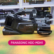 a) Panasonic HDC-MDH1 Professional Video Camera | Full HD Camcorder | 3MOS Sensor | 12x Optical Zoom | Built-in LED Light | Ideal for Events, Wedding & Video Production 🎥🔥