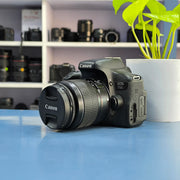 a) Canon EOS 750D DSLR Camera with 18-55mm III Lens | 18MP | Full HD Video | Flip Screen | Beginner Friendly | SK1034