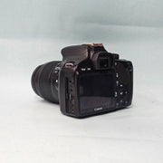 a) Canon EOS 550D DSLR Camera with 18-55mm IS II Lens | 18MP APS-C | Full HD Video | Beginner Friendly DSLR | Lightweight Camera | (Code AB05)