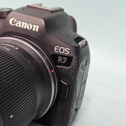 a) Canon EOS R7 Mirrorless Camera with RF-S 18-150mm IS STM Lens | 32.5MP APS-C | 4K 60p Video | Fast Dual Pixel CMOS AF II | High-Speed Hybrid Camera | SK1064