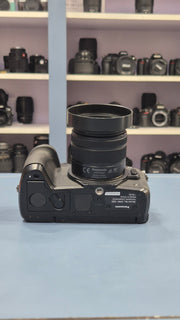 c) Panasonic Lumix G85 with 14-42mm Lens – 16MP 4K Mirrorless Camera | Weather-Sealed | 5-Axis Stabilization