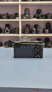 c) Sony Alpha A6400 + 18-135mm Zoom Lens (Excellent Condition)