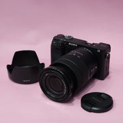 b) Sony A6400 Mirrorless Camera with 18-135mm f/3.5-5.6 OSS Lens | 24.2MP APS-C | 4K Video | Fast AF | SK522