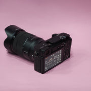 b) Sony A6400 Mirrorless Camera with 18-135mm f/3.5-5.6 OSS Lens | 24.2MP APS-C | 4K Video | Fast AF | SK522