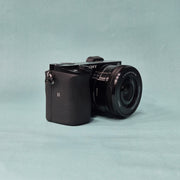 c) Sony A6100 Mirrorless Camera with Kit Lens – Excellent Condition