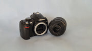 c) Nikon D3000 with 18-55mm Lens – 10.2MP DSLR Camera | Beginner Friendly | Sharp Image Quality