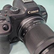 a) Canon EOS R7 Mirrorless Camera with RF-S 18-150mm IS STM Lens | 32.5MP APS-C | 4K 60p Video | Fast Dual Pixel CMOS AF II | High-Speed Hybrid Camera | SK1064