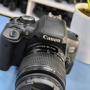 a) Canon EOS 750D DSLR Camera with 18-55mm III Lens | 18MP | Full HD Video | Flip Screen | Beginner Friendly | SK1034