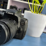 a) Canon EOS 750D DSLR Camera with 18-55mm III Lens | 18MP | Full HD Video | Flip Screen | Beginner Friendly | SK1034