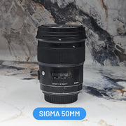 a) Sigma 50mm f/1.4 DG HSM Art Lens (Canon EF Mount) | Ultra-Sharp Prime | Beautiful Bokeh | Low-Light Performer | SK1050
