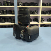 a) Nikon D3400 with 18-55mm VR Lens | 24.2MP Entry-Level DSLR Camera | Compact & Beginner Friendly | SK147
