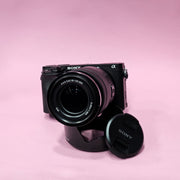 b) Sony A6400 Mirrorless Camera with 18-135mm f/3.5-5.6 OSS Lens | 24.2MP APS-C | 4K Video | Fast AF | SK522