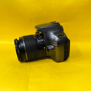 a) Canon EOS 1100D with 18-55mm f/3.5-5.6 IS II Lens | Beginner DSLR Camera for Photography & HD Video Shooting | SK196