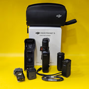 a) DJI Osmo Pocket 3 Creator Combo | 1-inch CMOS Sensor | 4K/120fps | 3-Axis Gimbal | Vlogging Camera Kit