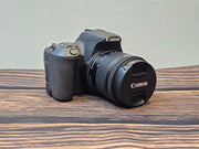 a) Canon EOS 200D DSLR Camera with 18-55mm STM Lens | 24.2MP APS-C | Dual Pixel AF | Full HD Video | WiFi & Bluetooth | Lightweight DSLR
