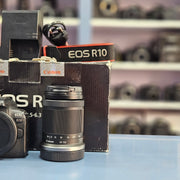 a) Canon EOS R10 Mirrorless Camera with RF-S 18-150mm IS STM Lens | 24.2MP APS-C | 4K Video | Fast Hybrid Autofocus | Compact All-Rounder | SK1046