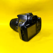 a) Canon EOS 1100D with 18-55mm f/3.5-5.6 IS II Lens | Beginner DSLR Camera for Photography & HD Video Shooting | SK196