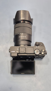 c) Sony Alpha A6400 + 18-135mm Zoom Lens (Excellent Condition)