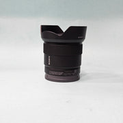 a) Sony E 11mm f/1.8 Ultra Wide-Angle Prime Lens | APS-C E-Mount | Fast f/1.8 Aperture | Lightweight Vlogging & Landscape Lens | SK1058