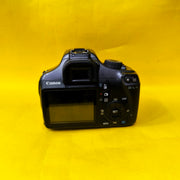 a) Canon EOS 1100D with 18-55mm f/3.5-5.6 IS II Lens | Beginner DSLR Camera for Photography & HD Video Shooting | SK196