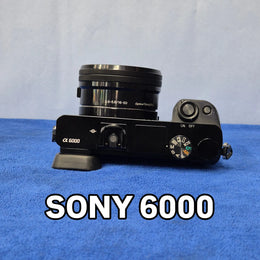 c) Sony Alpha A6000 + 16-50mm OSS Lens – Perfect for Photography & Video