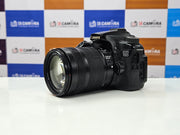a) Canon EOS 70D DSLR Camera with 18-135mm IS Lens | 20.2MP APS-C Sensor | Dual Pixel Autofocus | Full HD Video | Versatile Zoom Kit | SK1053