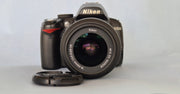 c) Nikon D3000 with 18-55mm Lens – 10.2MP DSLR Camera | Beginner Friendly | Sharp Image Quality