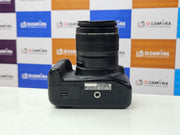 a) Canon EOS 1300D DSLR Camera with 18-55mm Lens | 18MP APS-C | Full HD Video | WiFi | Beginner Friendly DSLR