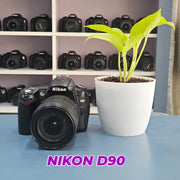 b) Nikon D90 DSLR Camera with 18-105mm VR Lens | 12.3MP | HD Video | Reliable Nikon DX Camera | SK252